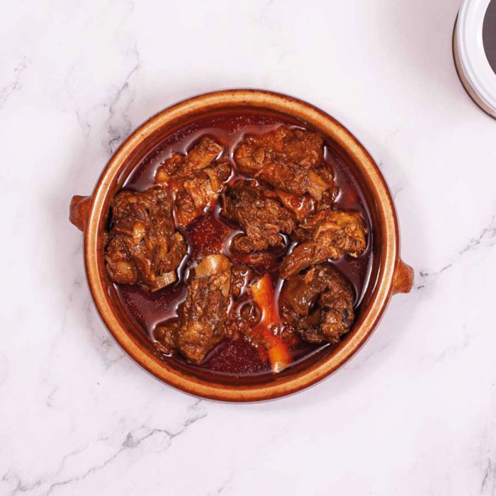 Costilla ibérica en manteca colorá